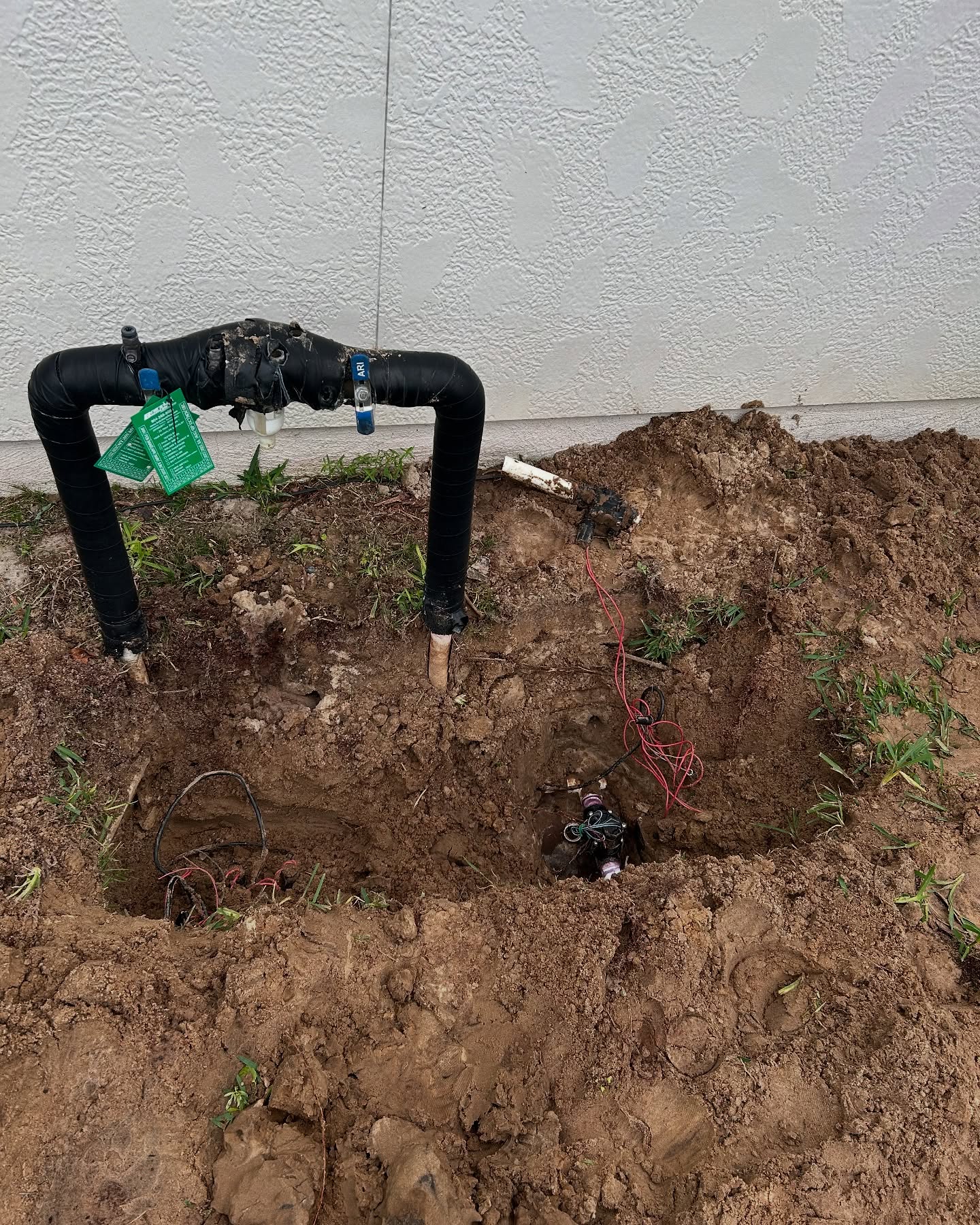 Excavated irrigation valve and backflow repair area