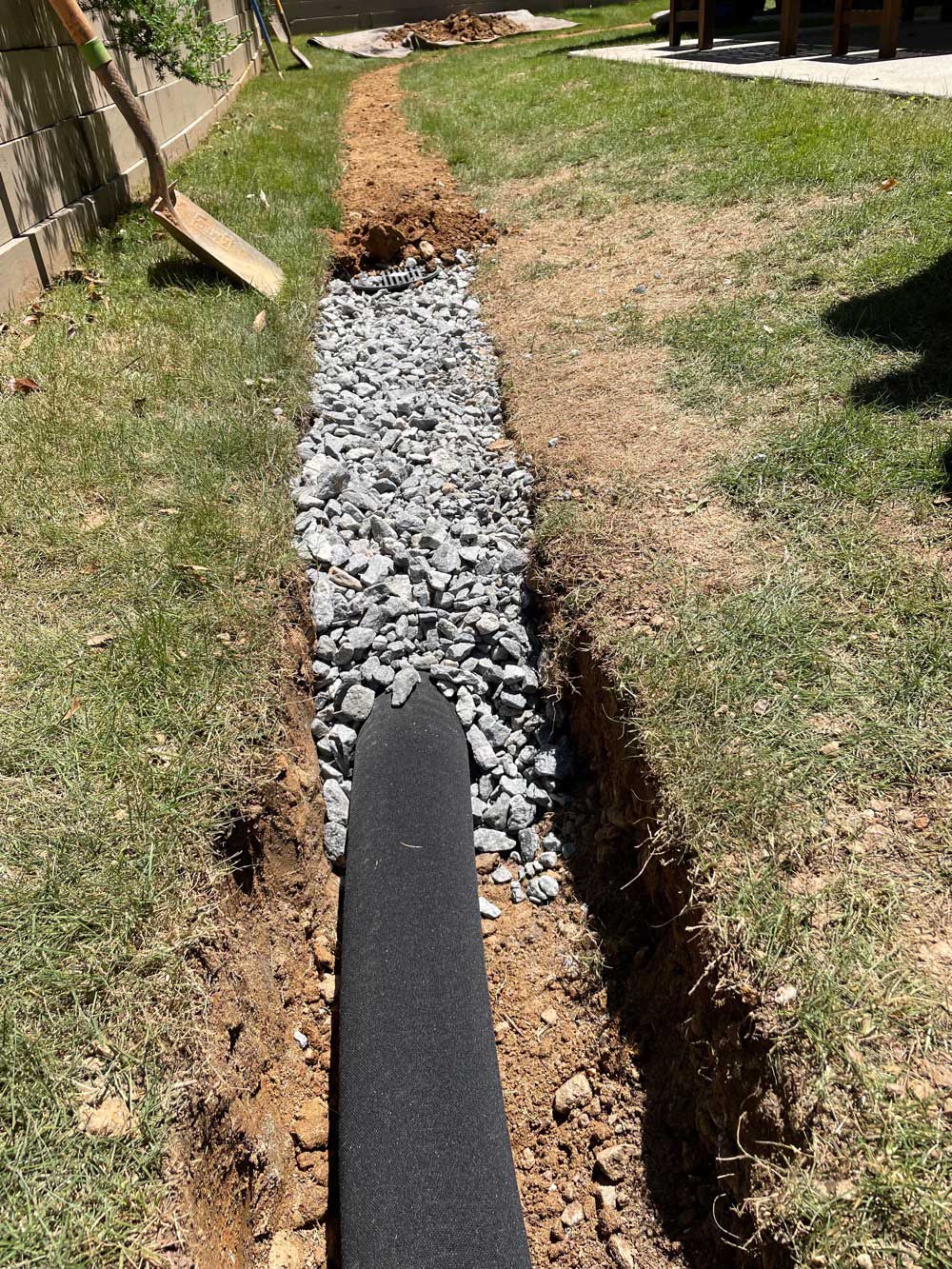 French drain trench filled with gravel
