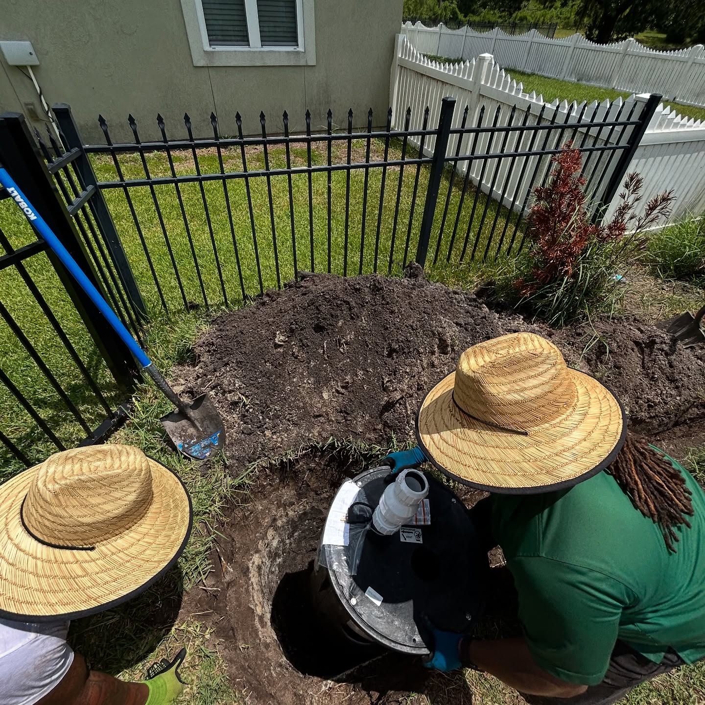 Crew installing a large drain basin