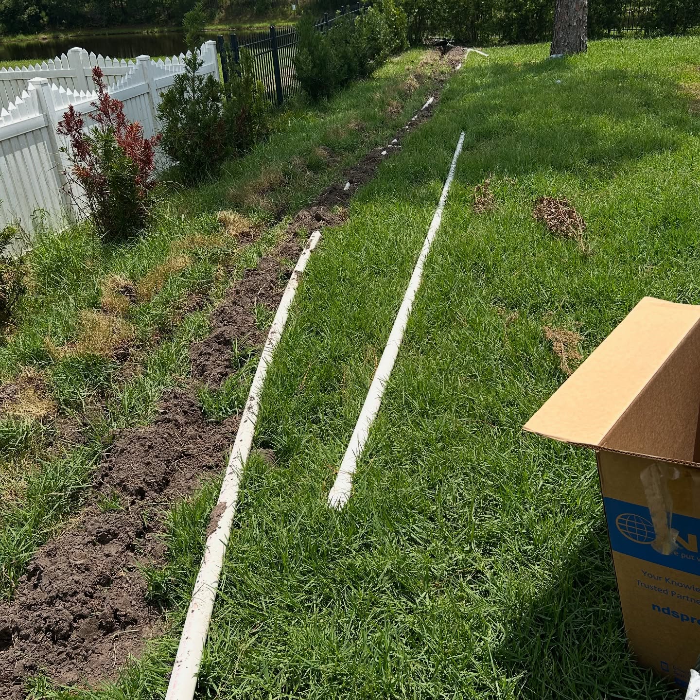 PVC irrigation pipes laid across grass